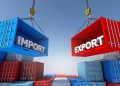 Two large shipping containers labeled IMPORT (blue) and EXPORT (red) are suspended by cranes above stacks of containers, illustrating trade.