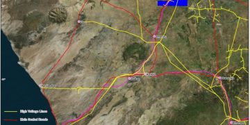 Aldoro resources | Mining and Energy Namibia | Namibia’s Leading Mining & Energy News Map of the Kameelburg project area showing high-voltage lines (yellow), main sealed roads (red), Kamiblan rail (purple), and the project license area (blue box) with town labels and coast to the left.