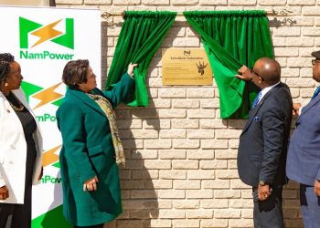 WhatsApp Image 2026-06-23 at 104254 AM | Mining and Energy Namibia | Namibia’s Leading Mining & Energy News Four officials unveil a bronze plaque on a brick wall while green curtains frame it, next to a NamPower banner.