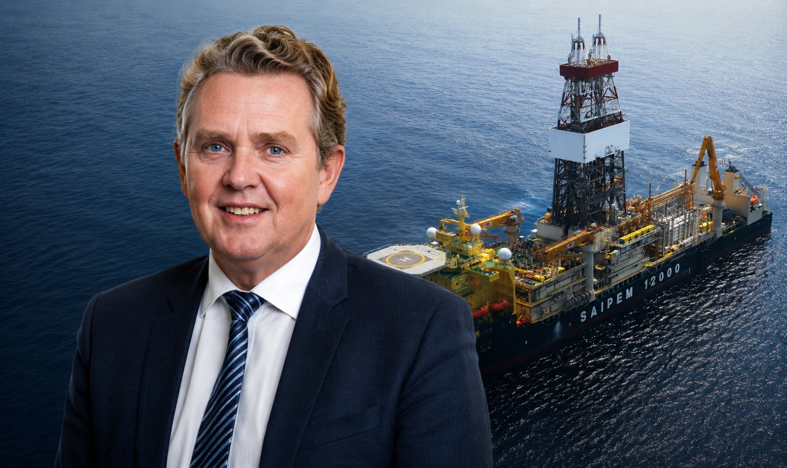 WhatsApp Image 2026-07-03 at 21438 PM | Mining and Energy Namibia | Namibia’s Leading Mining & Energy News Smiling businessman in a dark suit with a striped tie, set against an offshore oil drilling vessel at sea.