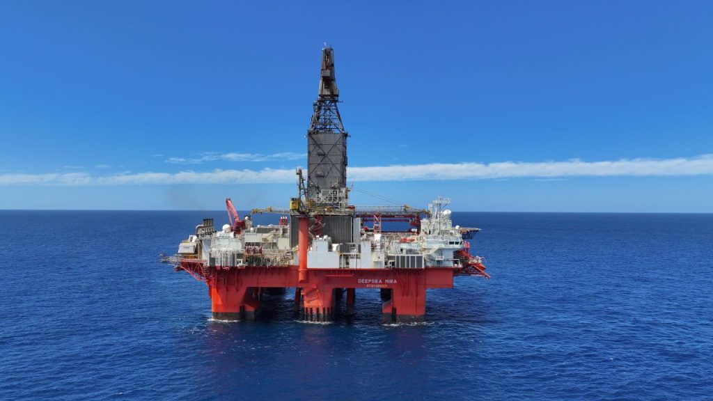 DEEPSEA MIRA | Mining and Energy Namibia | Namibia’s Leading Mining & Energy News Offshore oil rig/platform floating on calm blue ocean under a clear sky, with a tall drilling tower.