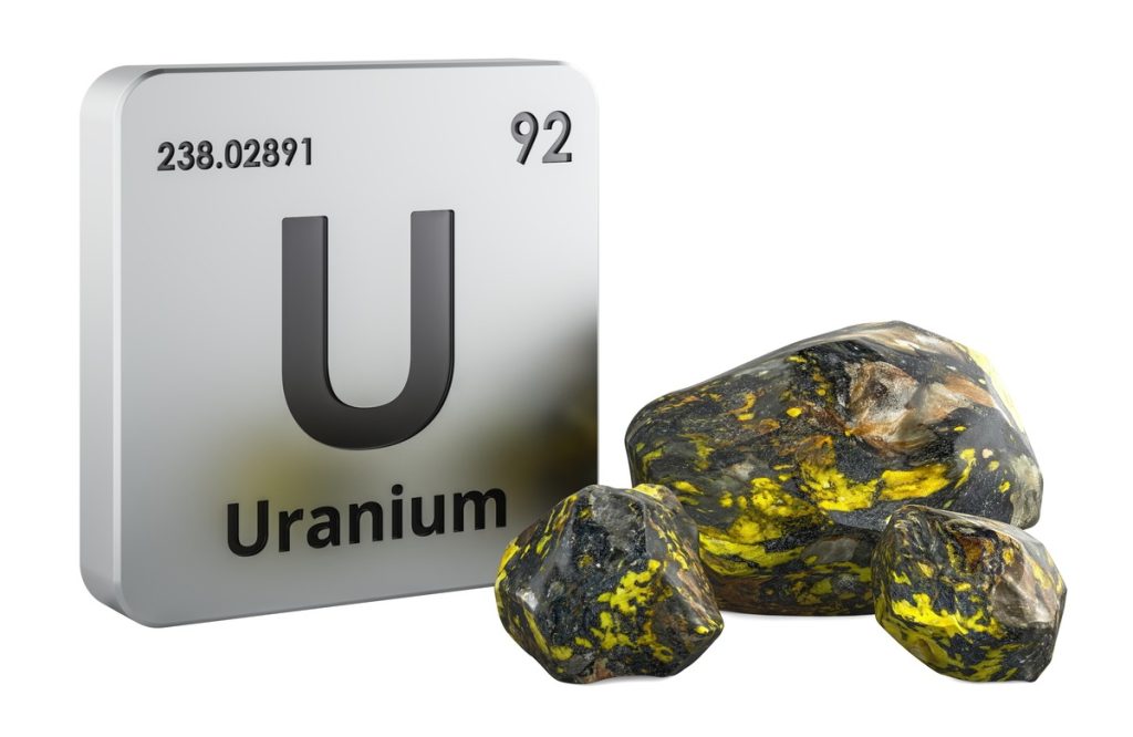 URANIUM7 | Mining and Energy Namibia | Namibia’s Leading Mining & Energy News Uranium element tile with symbol U, atomic number 92, beside yellow-green uranium ore rocks