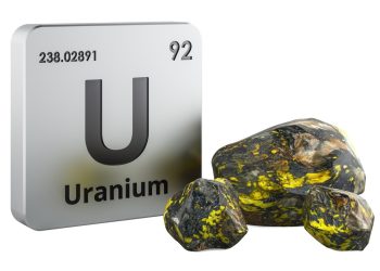 URANIUM7 | Mining and Energy Namibia | Namibia’s Leading Mining & Energy News Uranium element tile with symbol U, atomic number 92, beside yellow-green uranium ore rocks