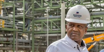 DANGOTE | Mining and Energy Namibia | Namibia’s Leading Mining & Energy News Man wearing a white hard hat with the Dangote Fertilizer logo at an industrial construction site.