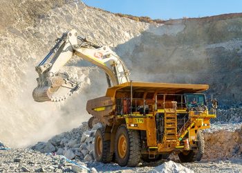 MINING10 | Mining and Energy Namibia | Namibia’s Leading Mining & Energy News Excavator loading rubble into a large mining dump truck at a quarry.