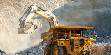 MINING10 | Mining and Energy Namibia | Namibia’s Leading Mining & Energy News Excavator loading rubble into a large mining dump truck at a quarry.