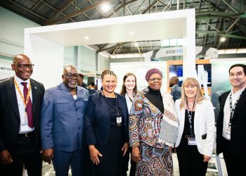 WhatsApp Image 2026-08-06 at 91214 PM | Mining and Energy Namibia | Namibia’s Leading Mining & Energy News Group of professionals at a trade show posing for a photo inside a booth, smiling warmly.