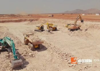 Open-pit mining site with multiple excavators and dump trucks on rocky terrain; OSINO logo bottom right.