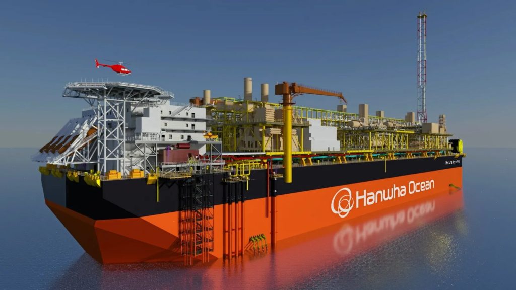 Large orange and black offshore drilling vessel with yellow scaffolding and a red helicopter overhead, branded Hanwha Ocean on the hull.