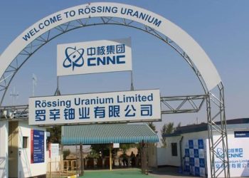 ROSSING URABIUM | Mining and Energy Namibia | Namibia’s Leading Mining & Energy News Welcome arch at a uranium mine entrance with signage for Rössing Uranium Limited and ENNC logo in blue.