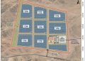 A site map of a solar PV park showing eight blocks labeled PV Block 1 to PV Block 8, each 6.25 MW, arranged in a grid with internal roads and an O&M building near the main substation, all within a red dashed boundary and public road access at the bottom.