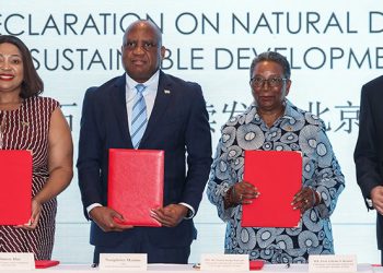 beijing-declaration-on-natural-diamonds-and-sustainable-development-signed-in-beijing-image-5 | Mining and Energy Namibia | Namibia’s Leading Mining & Energy News Four dignitaries stand behind a table, each holding a red folder at a signing ceremony for sustainable development goals in Beijing (Beijing Declaration on Natural Diamonds).