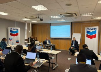 WhatsApp Image 2026-09-19 at 85610 AM | Mining and Energy Namibia | Namibia’s Leading Mining & Energy News Panel discussion in a conference room with Chevron banners, projector screen, and attendees using laptops and notes on tables.