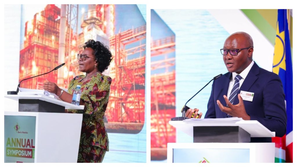 MixCollage-26-Sep-2026-07-19-AM-6665 | Mining and Energy Namibia | Namibia’s Leading Mining & Energy News Two speakers at a symposium podium: a woman in a colorful patterned dress speaks on the left, a man in a suit speaks on the right, with conference signage nearby.