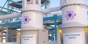 Two large white small modular reactor modules with SMR logo connected by teal framework at an industrial facility, panels labeled 'small modular reactor'