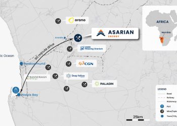 Map of Namibia's uranium mining sites along the coast near Swakopmund and Walvis Bay, with company logos (Asarian Energy, Rössing Uranium, Deep Yellow, Paladin, Bannerman).
